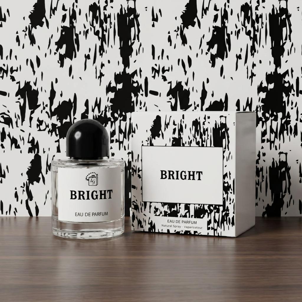 A clear glass perfume bottle with a black cap and a white label reading BRIGHT, placed beside its matching white and black patterned box on a wooden surface against a black-and-white abstract wall.
