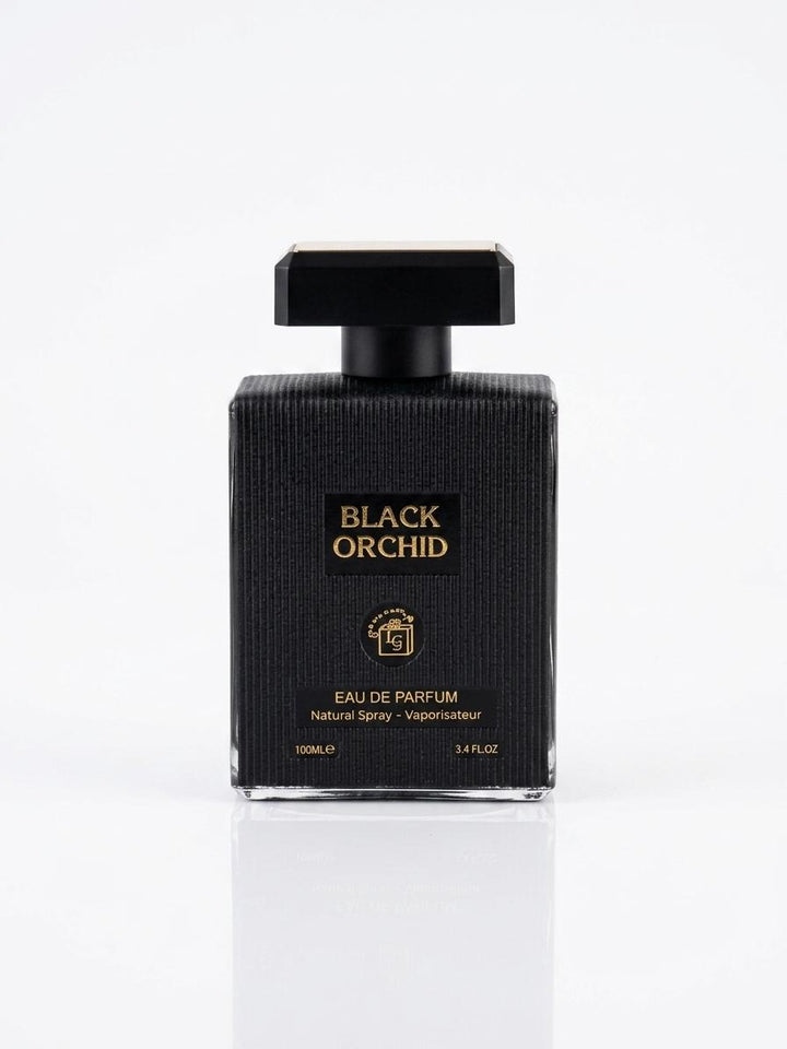 A rectangular black perfume bottle with a textured surface, a black cap, and gold lettering that reads 'BLACK ORCHID' and 'EAU DE PARFUM'. The bottle is centered on a clean white background with a soft reflection below.