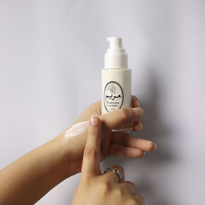 Applying Maryam moisturizing hand cream on hand